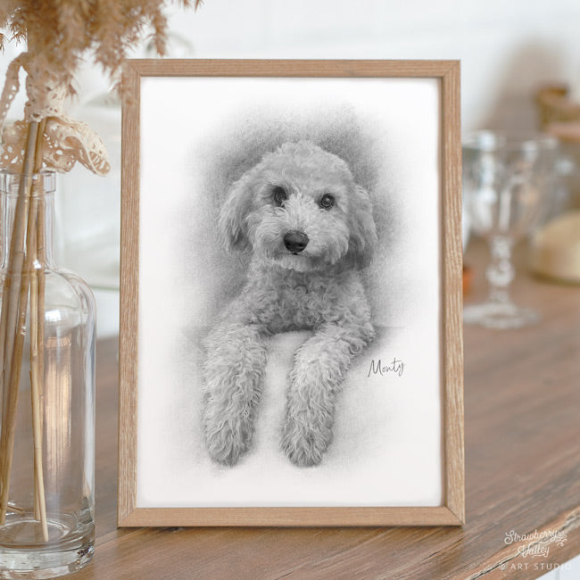 a black and white sketch of a dog portrait in an oak frame